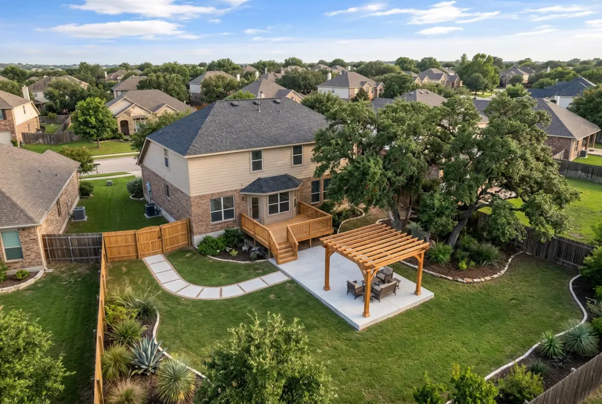 Backyard with a concrete patio, pergola, deck and walkway